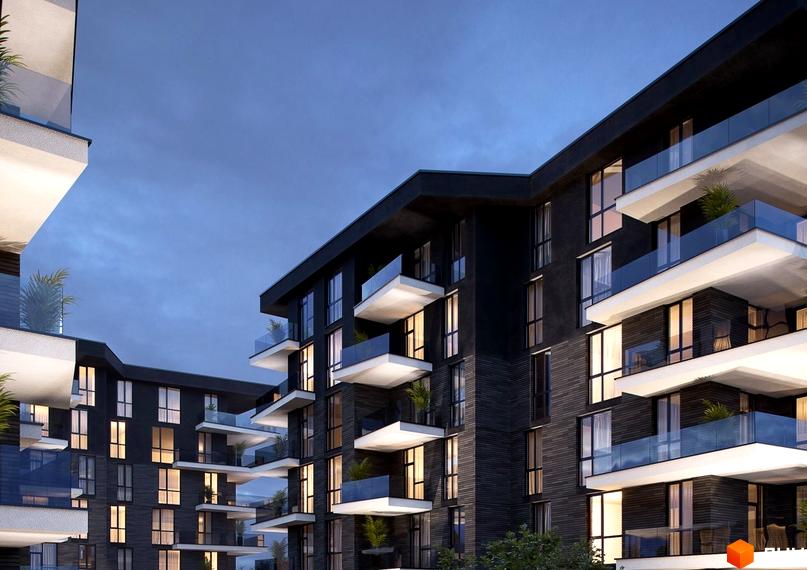 Зображення сторінки ЖК Artynov Hall. Багатоквартирний будинок з білими балконами та скляними огорожами, темний фасад, вечірнє небо.