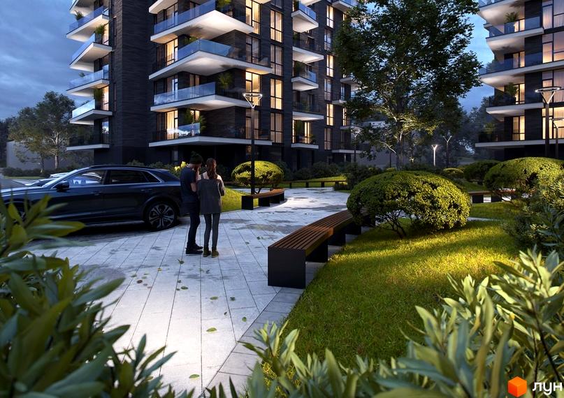 Висотна будівля ЖК Artynov Hall з темним фасадом та великими вікнами. На прибудинковій території розташовані лавки, зелені насадження та парковка для автомобілів.