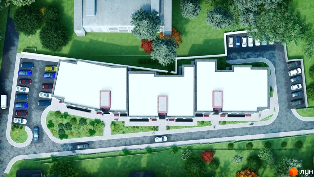 Житловий комплекс Новатор з висоти пташиного польоту. На території є парковка, зелені насадження та пішохідні доріжки.