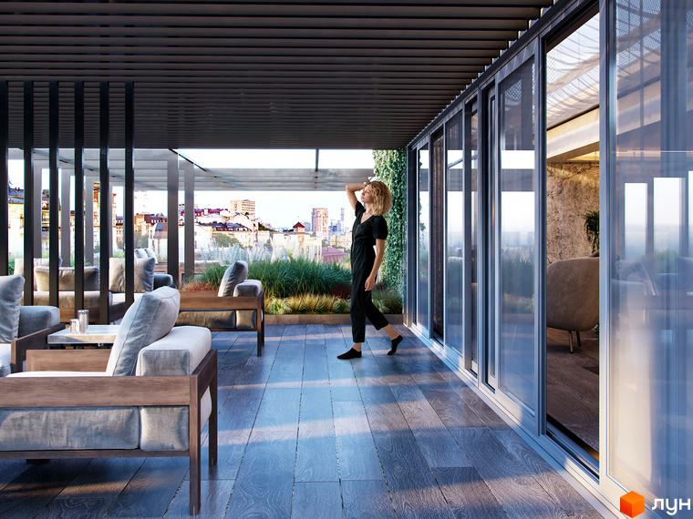 Тераса Житлового комплексу Krauss Gallery з дерев'яною підлогою, м'якими меблями, зеленими насадженнями та панорамним видом на місто.