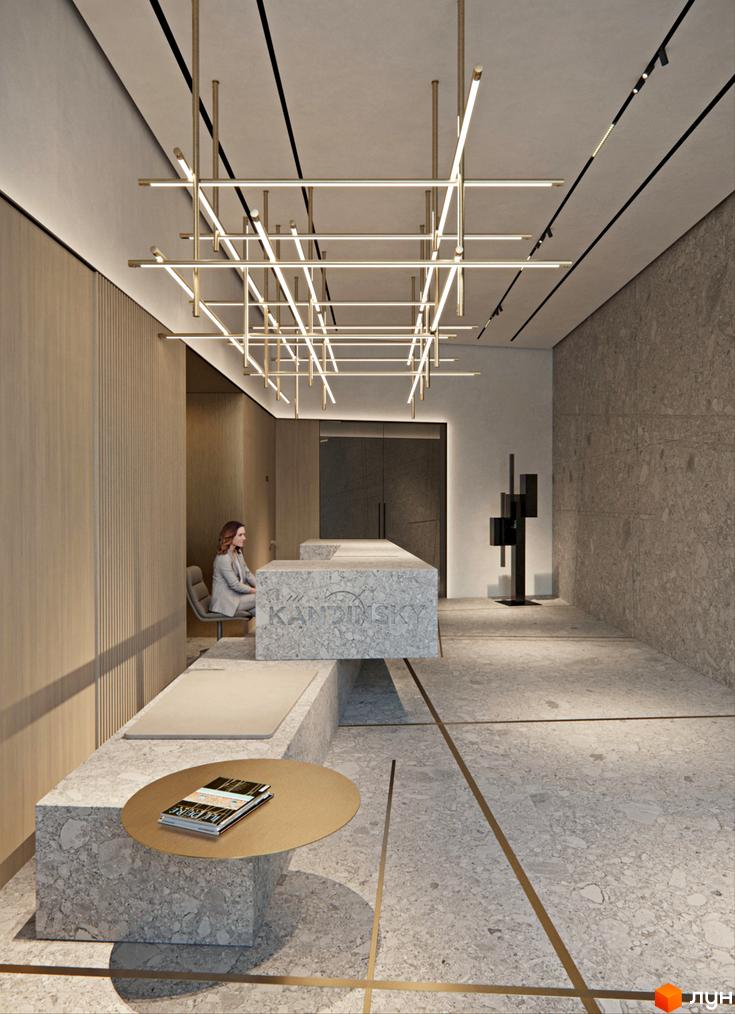 Інтер'єр холу житлового комплексу Kandinsky Odesa Residence з мармуровими стінами, підсвічуванням та стійкою рецепції. Жінка сидить на стільці в зоні очікування.
