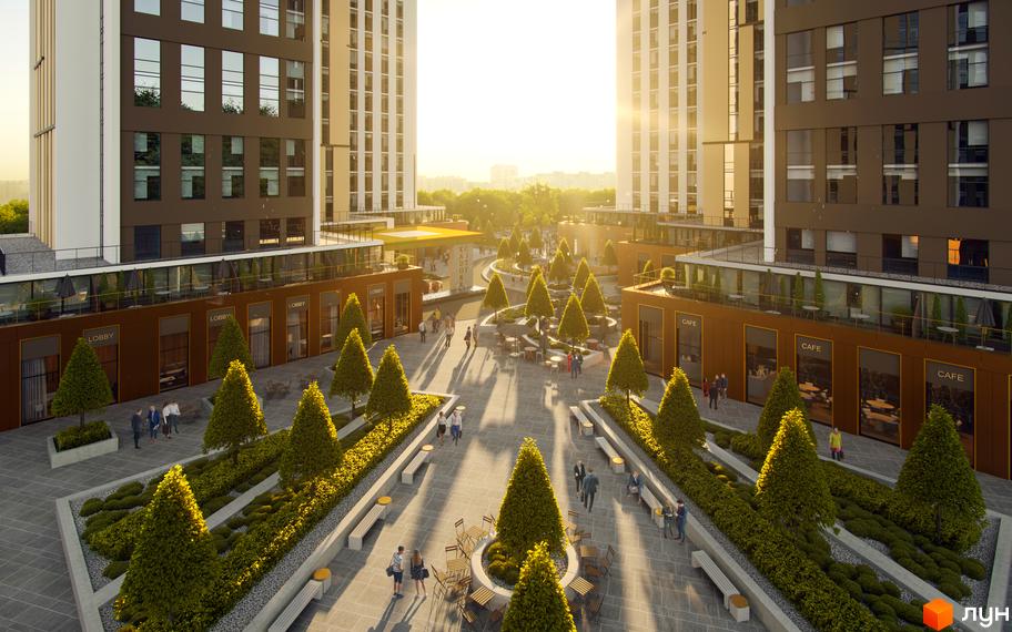 Житловий комплекс KADORR City з сучасними фасадами та доглянутою прибудинковою територією з деревами та зонами відпочинку.