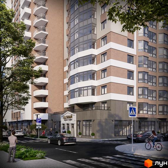 Житловий комплекс Удобний: багатоповерховий будинок з бежевим фасадом, білими смугами, балконами та великими вікнами. Поруч дорога, авто, зелень.