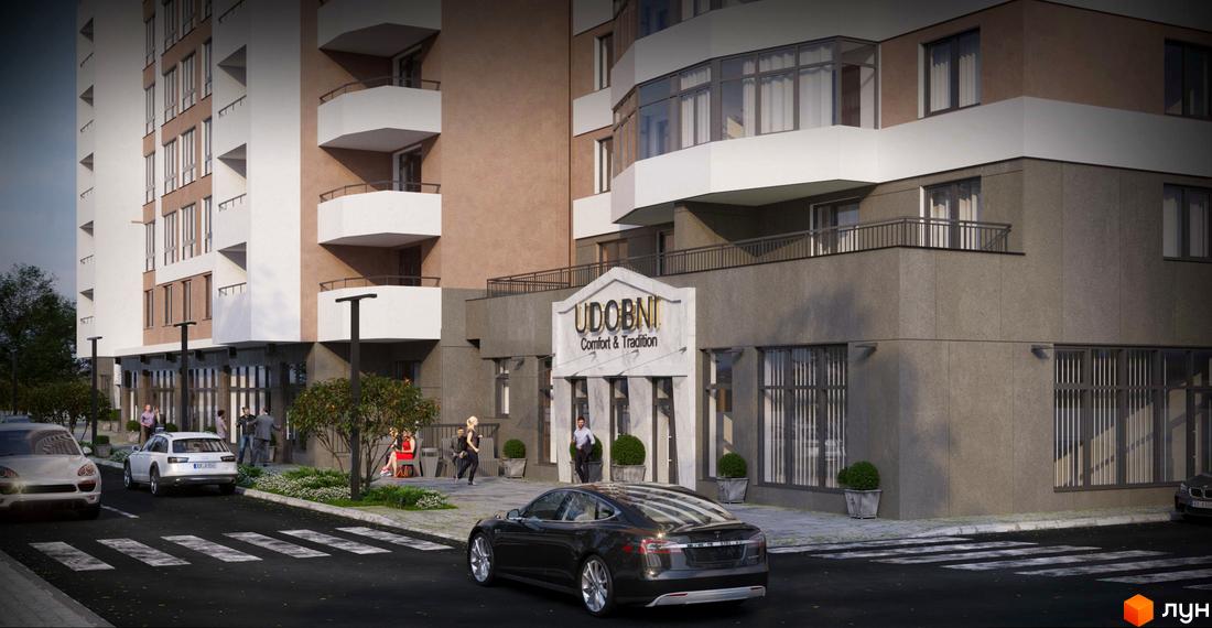 Зображення фасаду житлового комплексу Удобний. На передньому плані дорога з припаркованими автомобілями, тротуар з людьми та зелені насадження.
