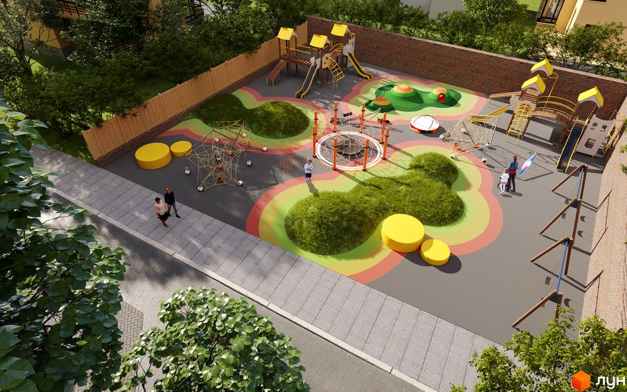 Дитячий майданчик ЖК Compass з яскравим покриттям та ігровими елементами. Навколо майданчика зелені насадження та зона відпочинку.