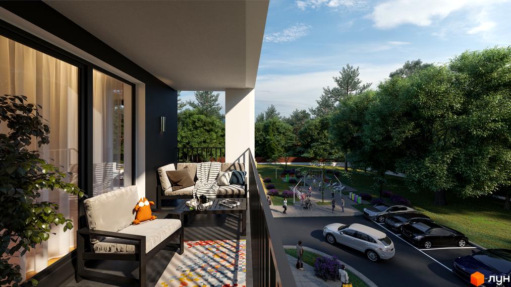 Житловий комплекс Еко-дім на Надійній з видом на зелену прибудинкову територію. На балконі стоїть мʼякі меблі та килимок.