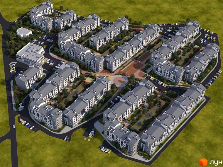 Вид зверху на будівлі ЖК Grand Comfort з сірими дахами та прибудинковою територією з парковками, деревами та дитячими майданчиками.