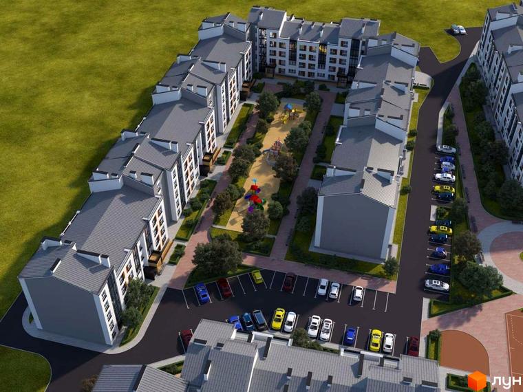 Вид на будівлі ЖК Grand Comfort з висоти пташиного польоту. На території є парковка, дитячий майданчик та зелені насадження.