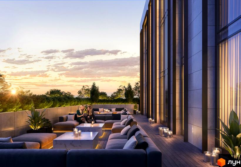 Новобудова DeLight Hall з високим фасадом та вертикальними панелями. На даху тераса з м'якими меблями та освітленням, де відпочивають люди.