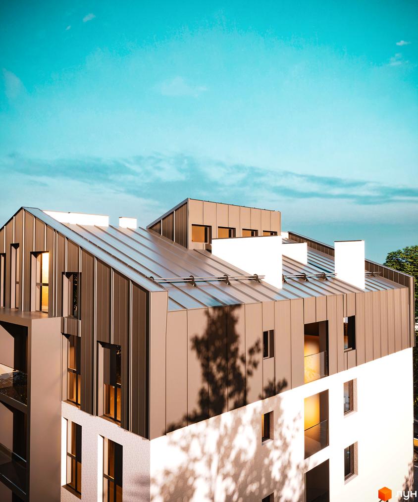 Зображення фасаду Новобудови Брест з металевим дахом та білими стінами. Навколо будинку видно дерева та блакитне небо.