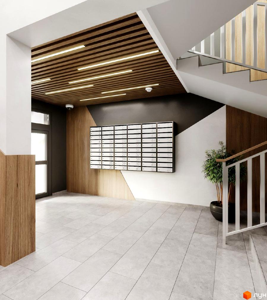 Інтер'єр вхідної групи Житлового комплексу Джем Сіті з поштовими скриньками та сходами. Оздоблення деревом та світла плитка на підлозі.