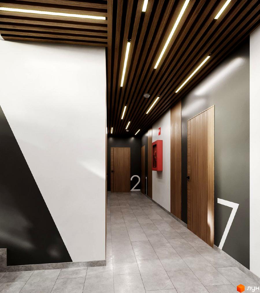 Коридор Житлового комплексу Джем Сіті з дерев'яною рейковою стелею, яскравим освітленням та світлою плиткою на підлозі.