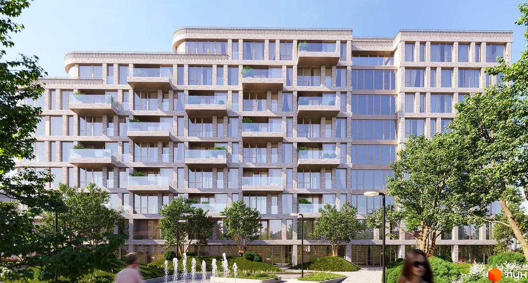 Житловий комплекс MOZART з світлої цегли з великими вікнами та скляними балконами. На передньому плані зелені дерева, кущі та фонтан.