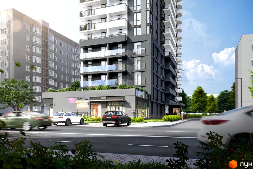 Висотна будівля житлового комплексу з балконами та скляними перилами. На першому поверсі розташовані комерційні приміщення, перед будинком дорога з автомобілями.