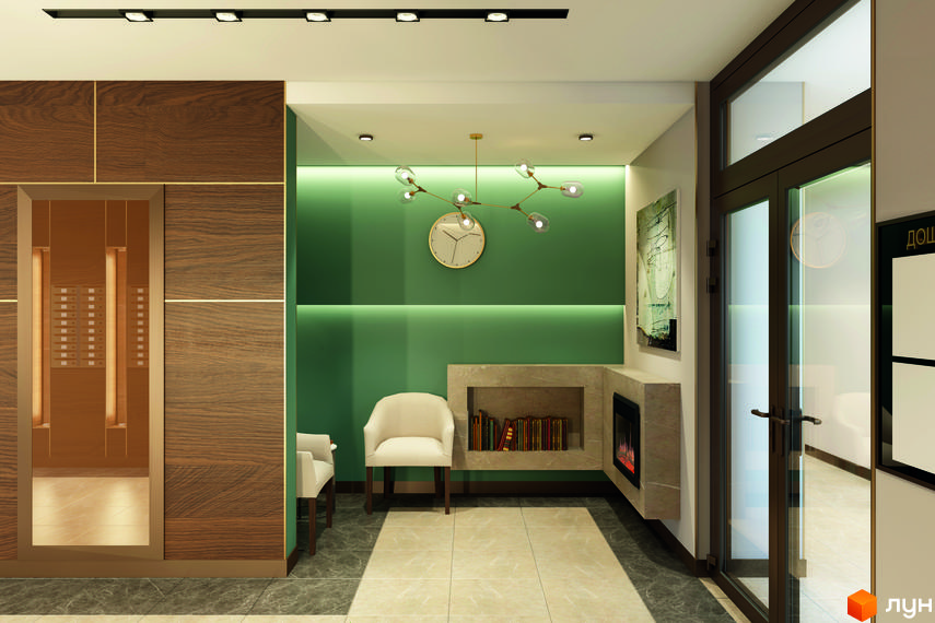 Інтер'єр лобі житлового комплексу Голосіївський з каміном та кріслами. Сучасний дизайн та оздоблення стін деревом.