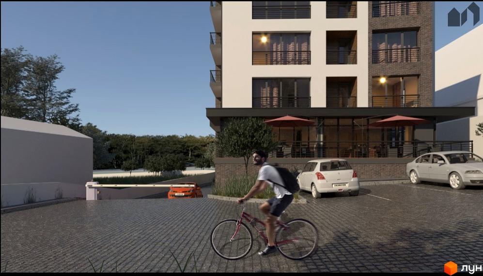 Житловий комплекс Кошицький має світлий фасад з темними балконами та цегляними вставками. Прибудинкова територія облаштована паркінгом та зеленню.