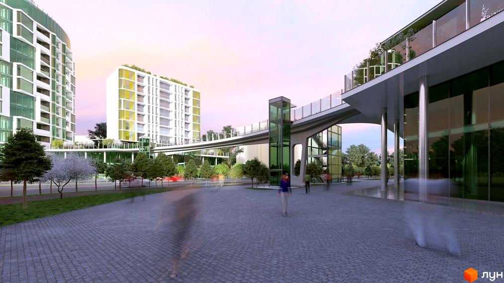 Житловий комплекс Смарагдові вежі з білими фасадами та зеленими вікнами, з'єднаний переходами. Навколо зелені насадження та брукована площадка.