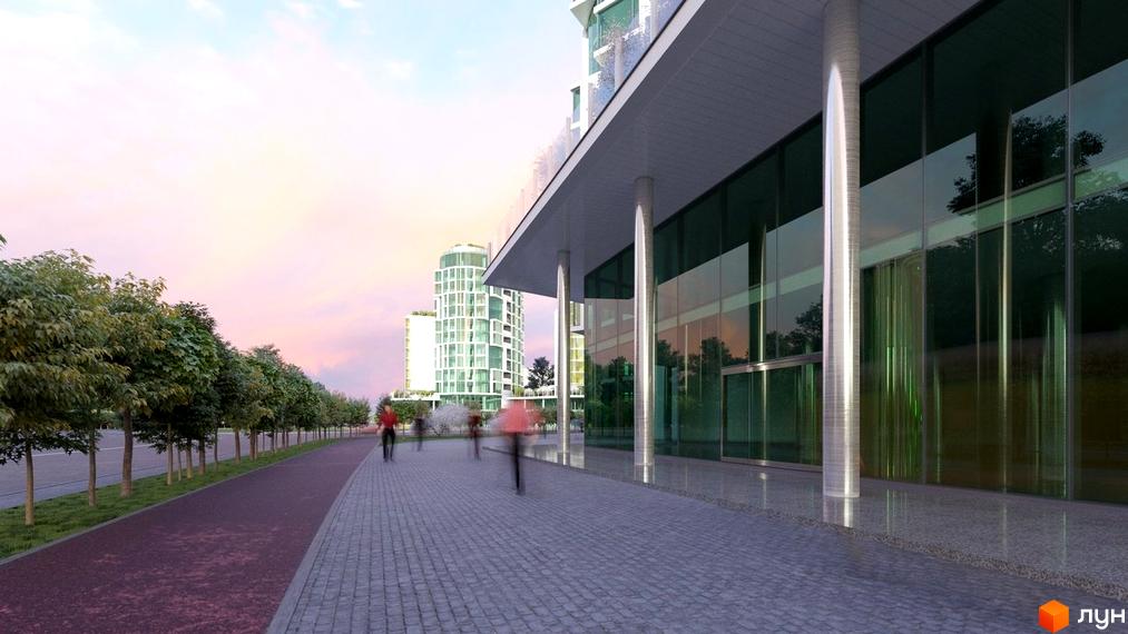 Житловий комплекс Смарагдові вежі з фасадами зі скла та металу, що виходить на алею з дерев та пішохідну доріжку з бруківки.