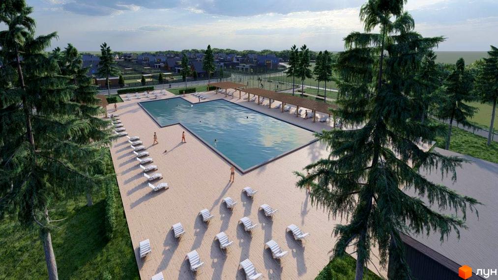 Котеджне містечко Freeland: відкритий басейн та зона відпочинку з шезлонгами. Навколо басейну розташовані зелені насадження та житлові будинки.