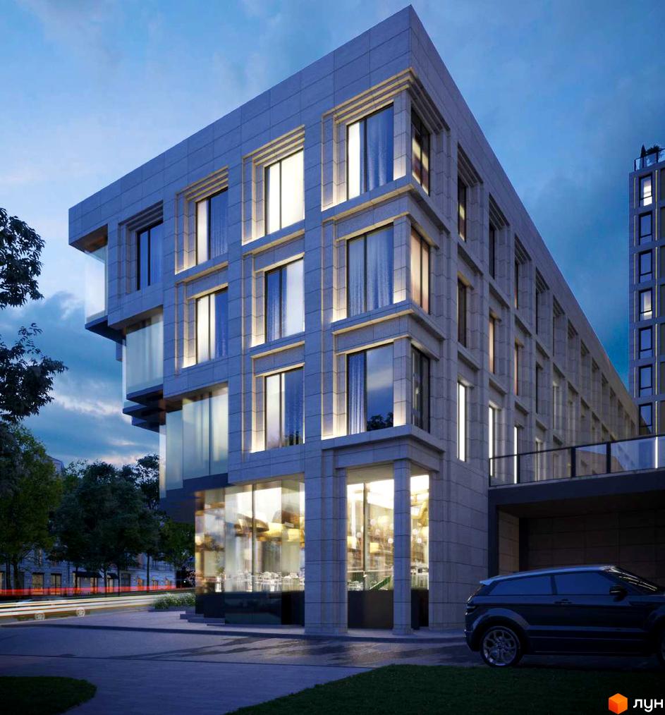 Багатоповерховий будинок Житловий комплекс CENTOWER з фасадом зі світлих панелей та великими вікнами. Перед будинком припаркований автомобіль та видно дорогу з вогнями.