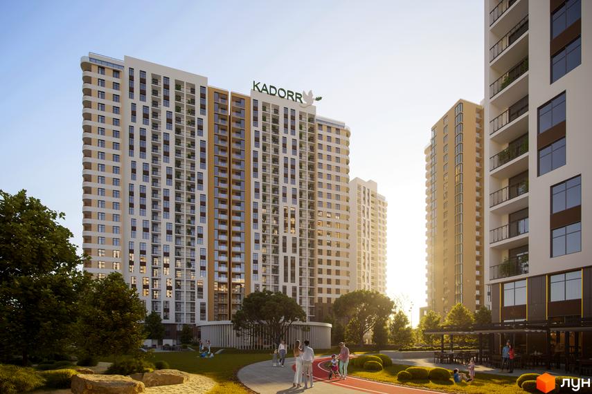Житловий комплекс KADORR City з білими та бежевими фасадами, балконами та панорамними вікнами. На прибудинковій території є зелені зони, доріжки та люди, що відпочивають.