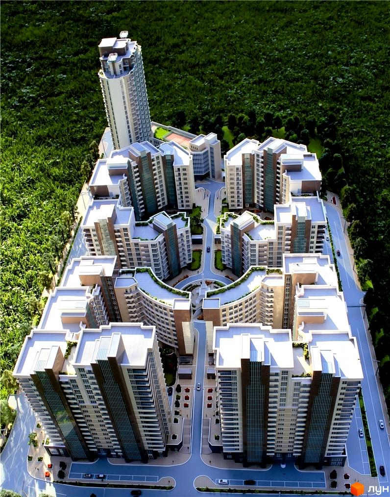 Житловий комплекс Французький квартал, що складається з багатоповерхових будівель світлих кольорів, розташованих навколо внутрішніх доріг та зелених зон.