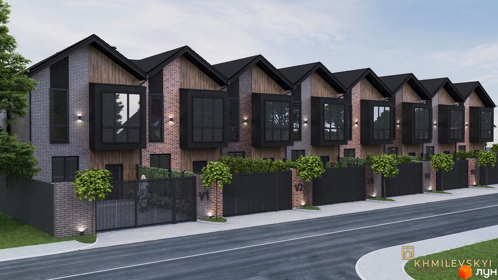 Таунхауси V8 townhouse – це сучасна забудова з цегляним фасадом та великими вікнами. Територія комплексу огороджена парканом з елементами дизайну.