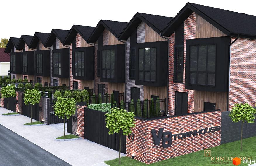 Зовнішній вигляд таунхаусів V8 townhouse з цегляним фасадом та великими вікнами. Прибудинкова територія з огорожею та деревами.
