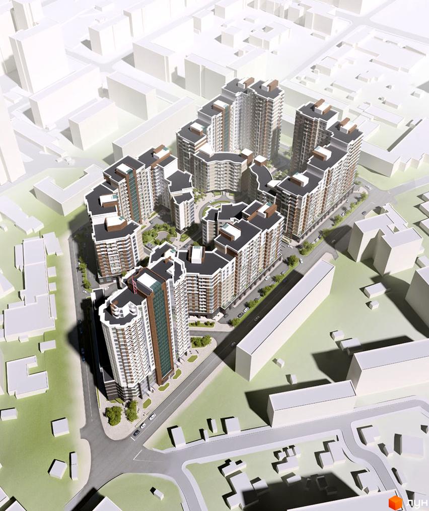 Вигляд зверху на Житловий комплекс Французький квартал: багатоповерхові будівлі зі світлими фасадами та темними дахами, оточені дорогами та зеленими дворами.