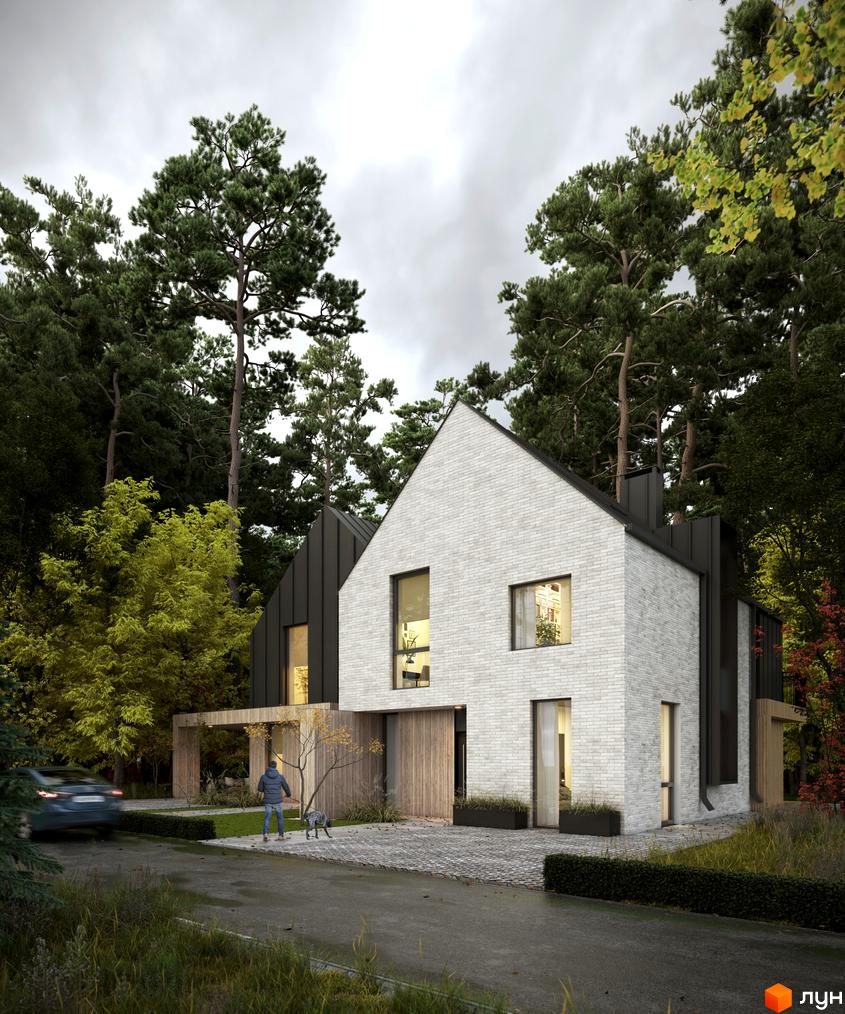 Двоповерховий будинок з білою цегляною кладкою, чорним дахом та великими вікнами. Перед будинком вимощена бруківкою територія, ростуть дерева.