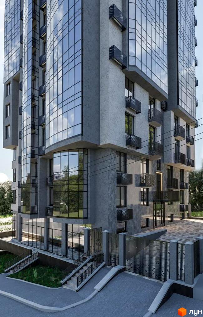 Житловий комплекс Зелений замок з сірим фасадом, панорамними вікнами та балконами. Біля будинку сходи та огороджена територія.