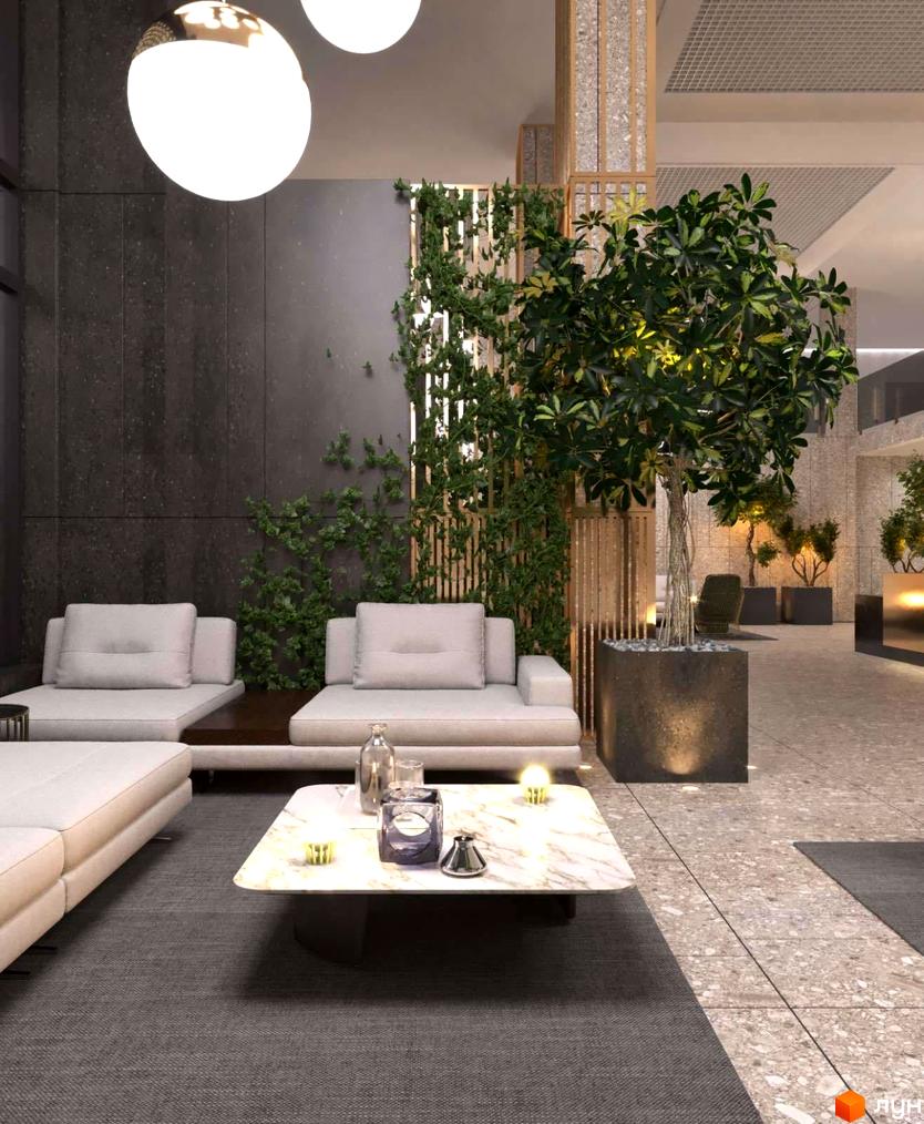Інтер'єр лобі житлового комплексу High Hills з диванами, кавовим столиком та рослинами. Сучасний дизайн зони відпочинку у новобудові.
