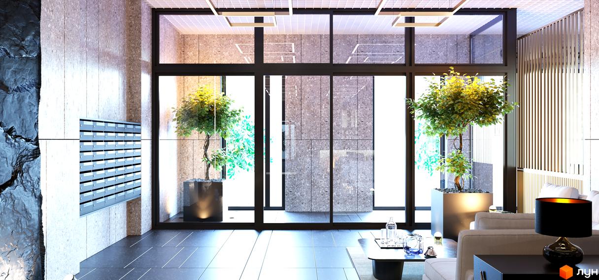 Сучасний хол житлового комплексу High Hills з великими вікнами, рослинами у великих горщиках та зручними місцями для відпочинку. На стіні розташована поштова скринька.