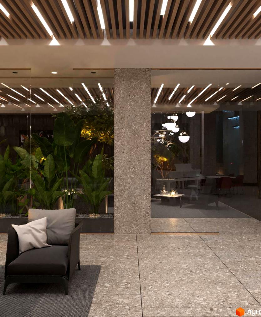 Житловий комплекс High Hills: комфортна зона відпочинку з кріслом та подушками біля скляної вітрини з рослинами та елегантними світильниками.