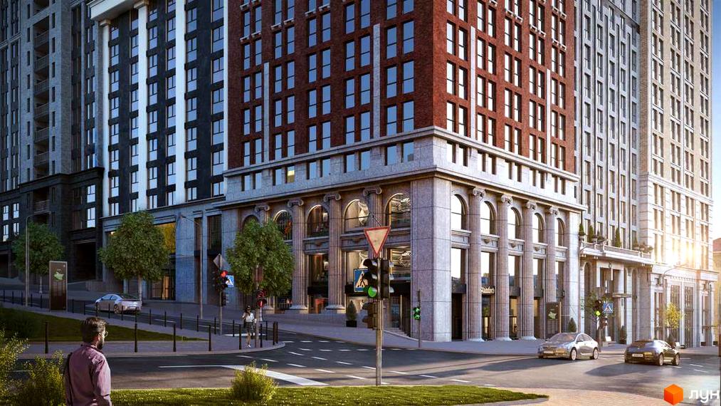 Житловий комплекс Stanford. Висотна будівля з цегляними фасадами та колонами на першому поверсі. Навколо будинку облаштована прибудинкова територія з дорогою та зеленими насадженнями.