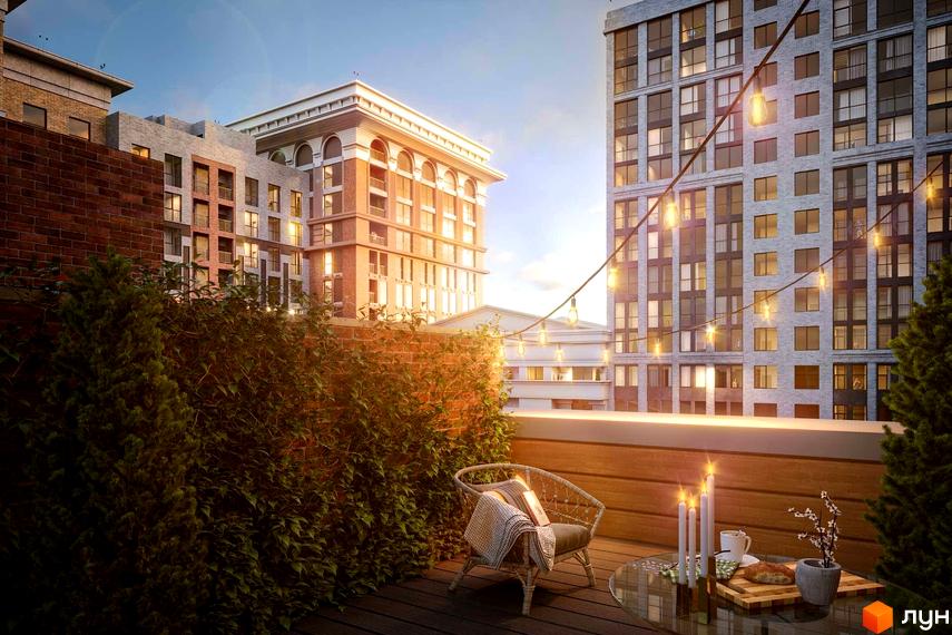 Зображення тераси в Житловому комплексі Stanford. Вид на будівлі з великими вікнами та ліхтарями, що створюють затишну атмосферу.