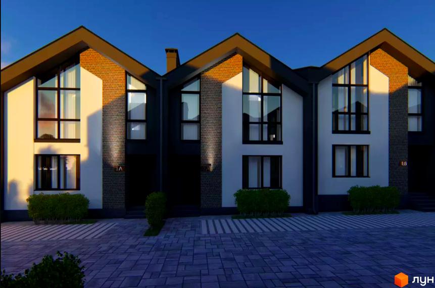 Сучасні таунхауси Idilika Home з великими вікнами та цегляними вставками, розташовані на вимощеній бруківкою території з доглянутими кущами.