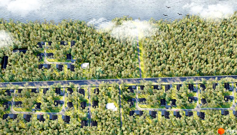 Котеджне містечко КМ Green Lake з чорними дахами будинків, розташоване серед густого зеленого лісу біля водойми.