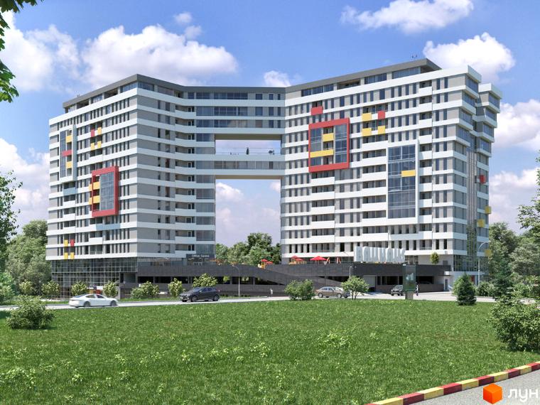 Житловий комплекс Bauhaus – це багатоповерхова новобудова з незвичайною архітектурою та скляним переходом між секціями. Навколо комплексу розташована зелена зона та дорога з автомобілями.