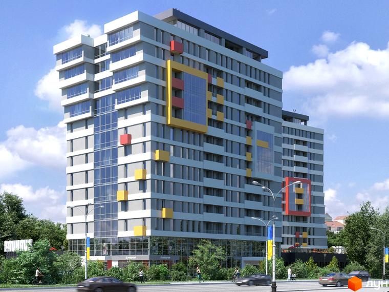 Житловий комплекс Bauhaus – це багатоповерхова новобудова з яскравими кольоровими акцентами на фасаді, розташована біля дороги з деревами та хмарним небом.