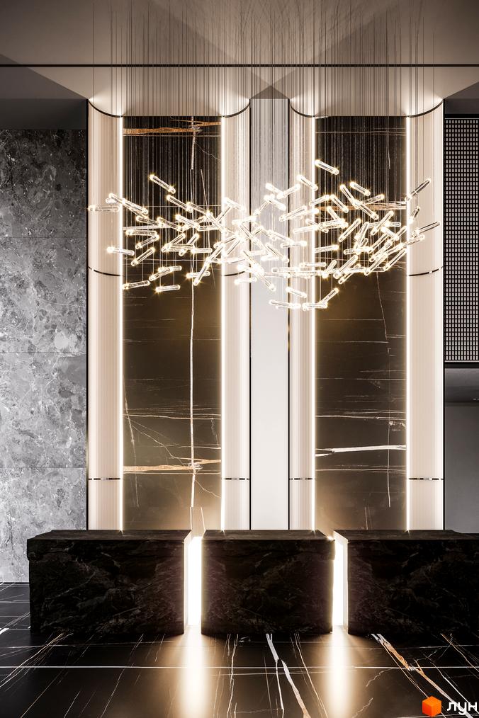 Rusaniv Residence: розкішний інтер'єр лобі з мармуровими стійками та дизайнерською люстрою. Сучасний дизайн новобудови для комфортного життя.