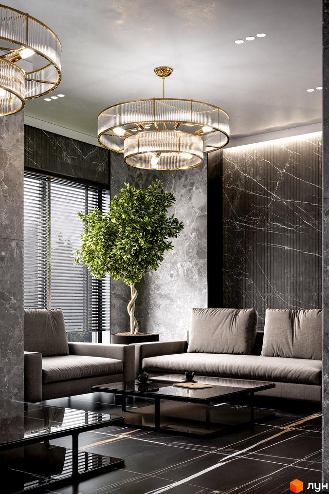 Інтер'єр вітальні в житловому комплексі Rusaniv Residence з диванами, журнальними столиками та двома підвісними люстрами.
