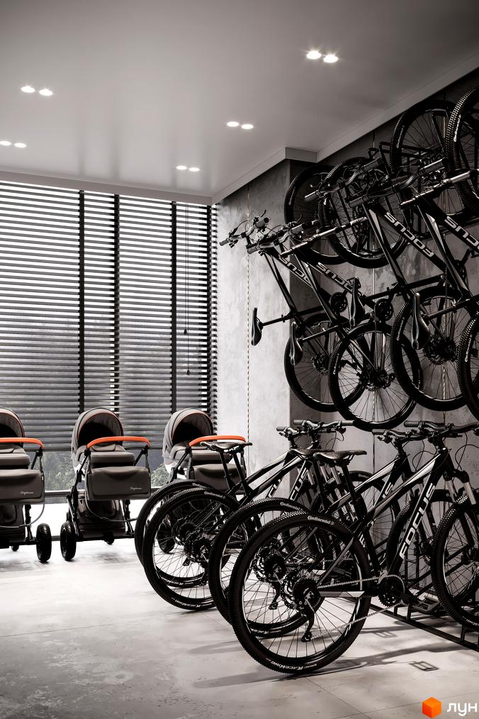 Зображення паркінгу для велосипедів та дитячих візочків у Житловому районі Rusaniv Residence. Вигляд зсередини приміщення.