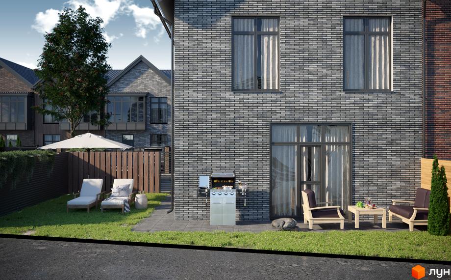 Зовнішній вигляд будинку з сірої цегли з великими вікнами та прибудинковою територією з зоною відпочинку та барбекю. КМ SIB Home - котеджне містечко для комфортного життя.