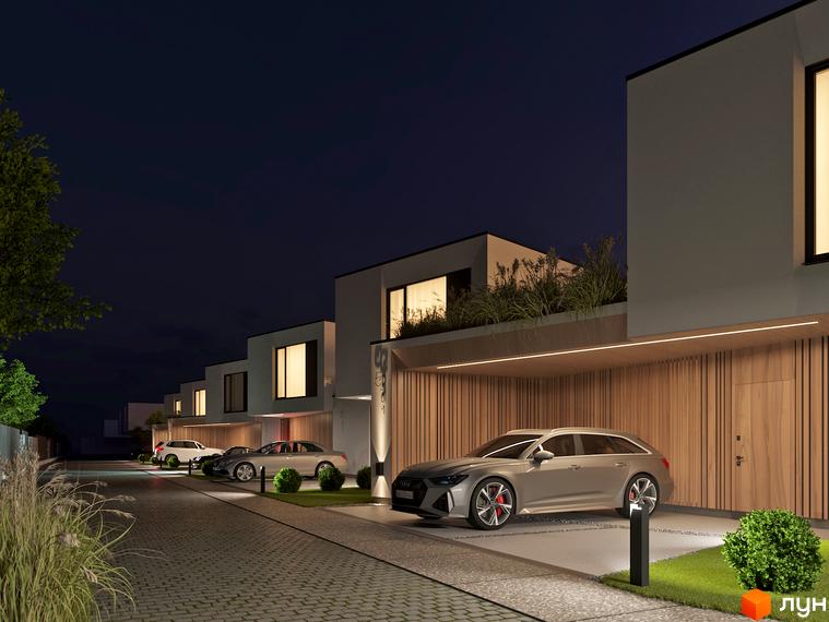 Котеджне містечко VIA 52. Сучасні будинки з гаражами та доглянутою прибудинковою територією в нічний час.