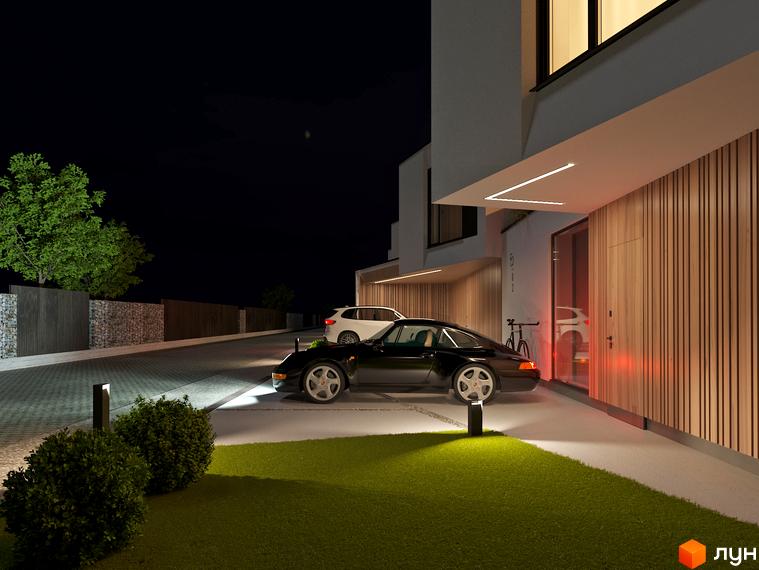 Котеджне містечко VIA 52 з сучасним фасадом та підсвіткою вночі. Прибудинкова територія з газоном, кущами та освітленням.