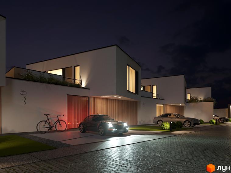 Котеджне містечко VIA 52 з сучасними будинками та доглянутою прибудинковою територією вночі. На території розташовані автомобілі та велосипед.