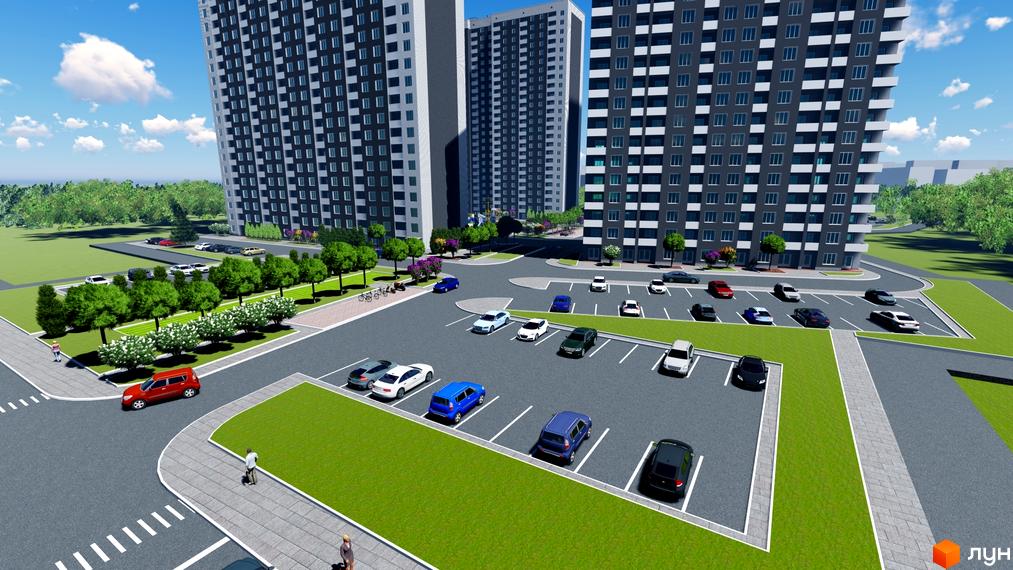 Житловий комплекс Navigator 2 з паркінгом та зеленими зонами. Сучасна архітектура будинків та доглянута прибудинкова територія.