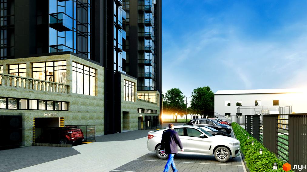 Багатоповерховий будинок Житлового комплексу Uzh Towers з темним фасадом та скляними вікнами. Поруч парковка та в'їзд до підземного паркінгу.