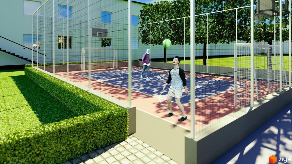 Зображення ігрового майданчика з баскетбольним кільцем та футбольними воротами біля Новобудови Uzh Towers.